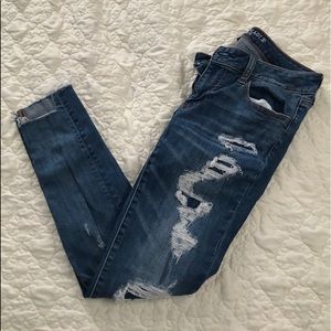 American Eagle super low jegging ripped pants.